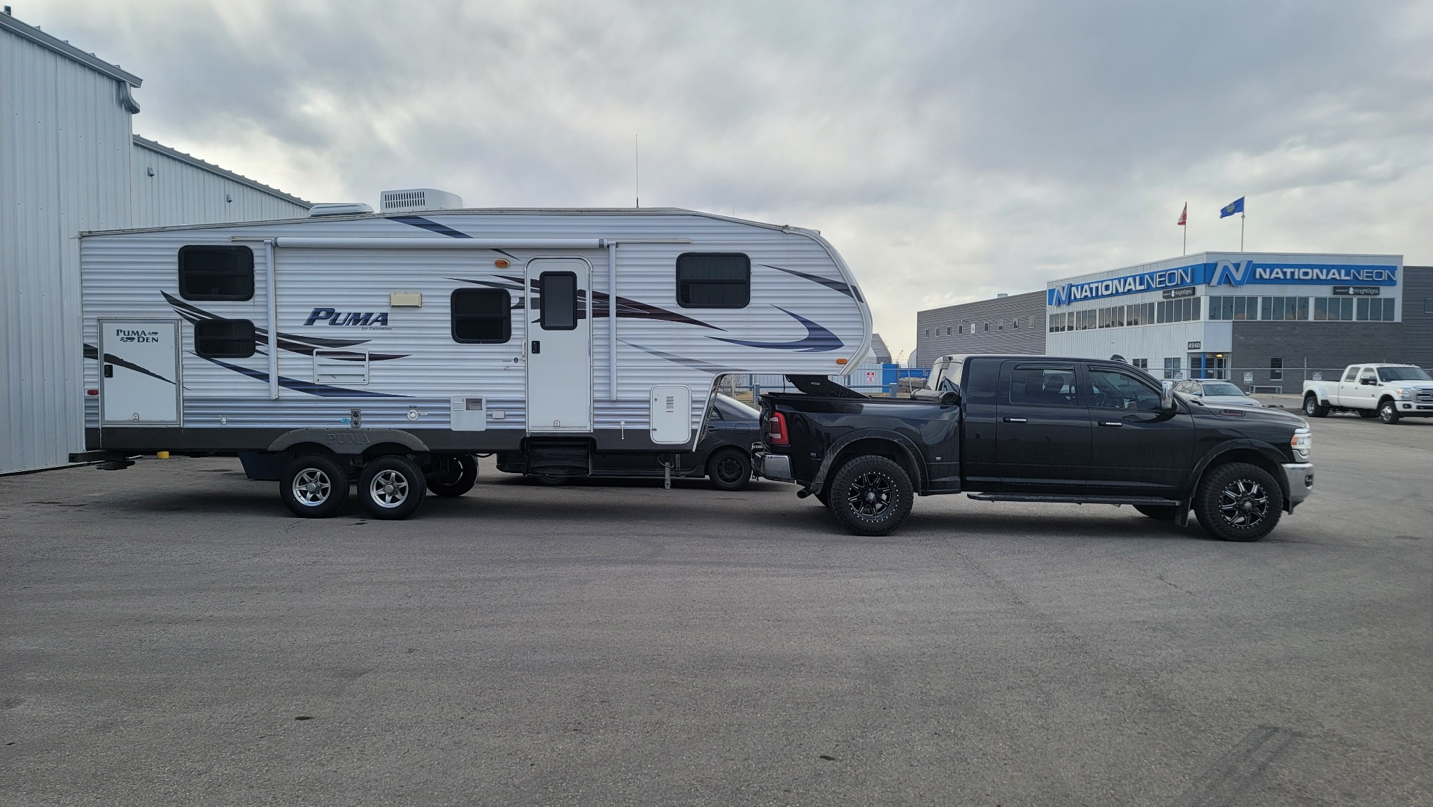 Dave's Towing transporting a fifth‑wheel trailer